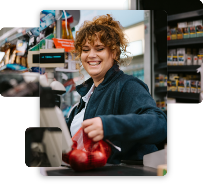 Female cashier passing the products through the bar code reader at supermarket checkout. Woman working at grocery store cash register.