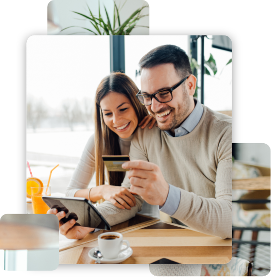 Young couple buying online with credit card and tablet in a coffee shop.