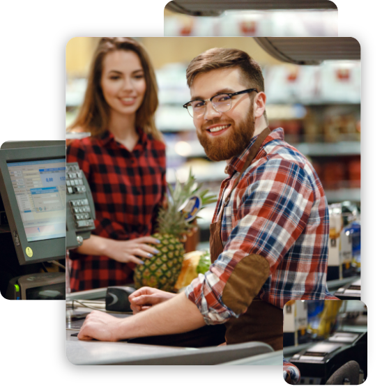 Cheerful cashier man on workspace in supermarket shop.